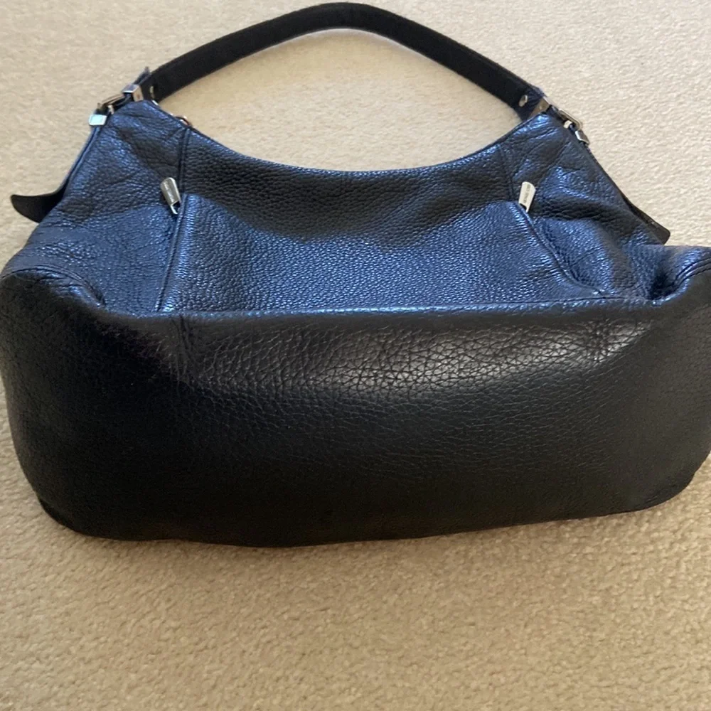 Michael Kors black leather shoulder bag, silver hardware logo on zipper, clean